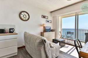 a living room with a view of the ocean at Exceptional stay facing the Atlantic Sea-view apartment with balcony in Saint-Gilles-Croix-de-Vie