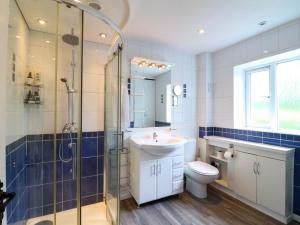 a bathroom with a sink toilet and a shower at The Chimes in Castleton +19 photos