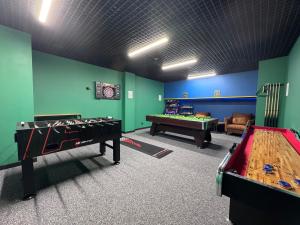 a room with two ping pong tables and ping pong balls at Apartament Ski &Sun in Świeradów-Zdrój +13 photos