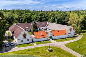 an aerial view of a church with orange roofs at Resort Biskupský Dvůr in Višňová