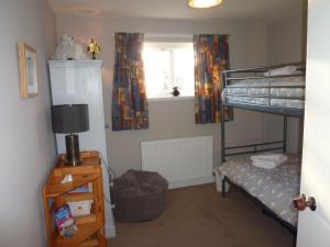 Ένα ή περισσότερα κρεβάτια σε δωμάτιο στο Camusmore House