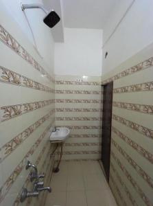 a bathroom with a sink and a shower at Hotel Geetanjali in Lucknow