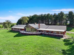 an aerial view of a large building in a field at The Lodge at Eagle Rock Farm, in Mandemar