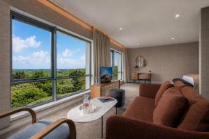 a living room with a couch and a table at Aghadoe Heights Hotel & Spa in Killarney