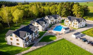 an aerial view of a house with a pool at Łebska Osada- basen, parking in Żarnowska