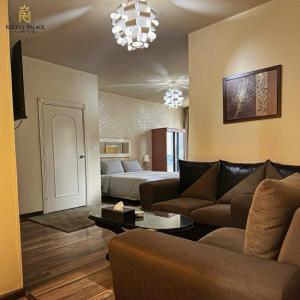 a living room with a couch and a bed at Regent Palace Hariz Hotel in Aley