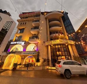a building with a car parked in front of it at Regent Palace Hariz Hotel in Aley