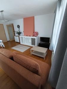 a living room with a couch and a table at Au cœur de Givet in Givet