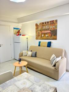 a living room with a couch and a table at evaxila papaflessa 机场附近 in Glyka Nera