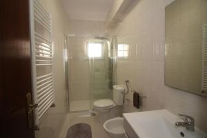 a bathroom with a shower and a toilet and a sink at Paraíso do Gerês in Geres +20 photos