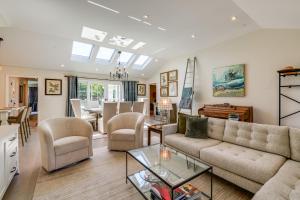 a living room with a couch and a table at Walkable Mill Valley Gem: Private Patio + Yard in Mill Valley