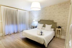 Cama o camas de una habitación en Natura Petit Hotel