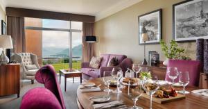 a living room with a table with wine glasses at Aghadoe Heights Hotel & Spa in Killarney