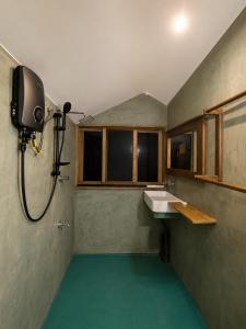 a bathroom with a sink and a shower at Visari Fall Villa Ella in Ella