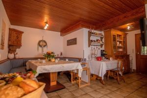 a kitchen with two tables in a room at Dreibettzimmer mit Dusche und Wc in Lennestadt +7 photos
