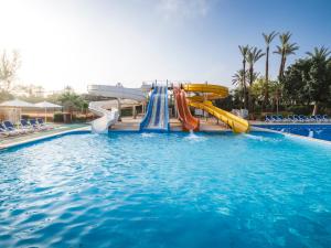 a water slide in a pool at a resort at Aqualis Club Resort Marrakech in Marrakesh
