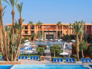 a resort with a pool and chairs and palm trees at Aqualis Club Resort Marrakech in Marrakesh +66 photos