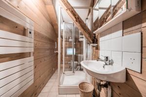 a bathroom with a sink and a shower at Chalet Familial Chaleureux in Abondance +34 photos