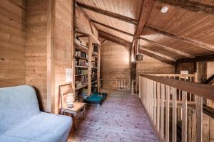 a living room with a couch and a table at Chalet Familial Chaleureux in Abondance