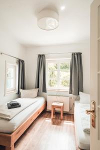 a room with two beds and a window at Schneekäppchen 1 in Winterberg