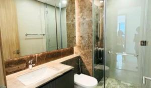 a bathroom with a sink and a glass shower at Aahotel by ABCIS in Phước Mỹ
