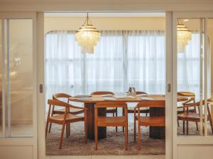 a dining room with a table and chairs at Hotel Coeur Marin in Les Sables-d'Olonne +32 photos