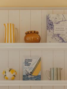 a shelf with various items on it at Hotel Coeur Marin in Les Sables-d'Olonne