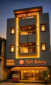 a hotel with a sign that reads hotel mecca ac rooms at Hotel Meera in Bāwal
