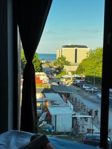 a view from a bedroom window of a parking lot at Beach apartments Ema in Kranevo