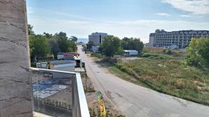 a view of a street from a balcony of a building at Beach apartments Ema in Kranevo