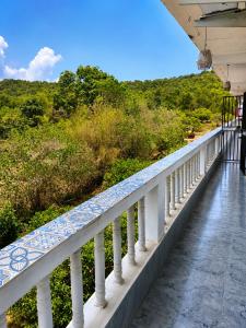 a balcony of a house with a view at Bhumika by evaddo stays in Mandrem