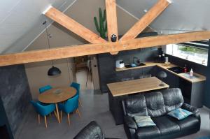 an overhead view of a room with a table and chairs at Horizon d'or in Profondeville