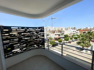 a balcony with a view of a city at Seven Floors in Tunis