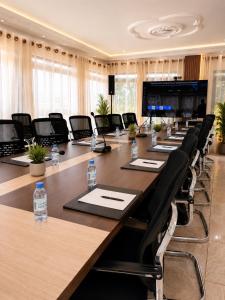 a large conference room with a long table and chairs at Maria Gracia House in Grand-Bassam +23 photos