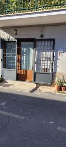 a building with doors and windows on a street at LA CASA DI SIRA in Veiano