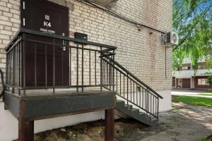 a building with a staircase next to a door at K4 Jonava Rooms in Jonava
