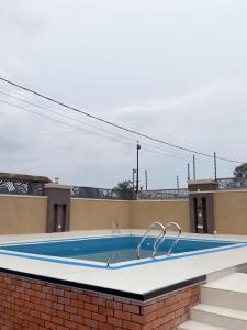 a swimming pool on the roof of a building at The Serene Sanctuary in Kampala