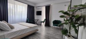Katil atau katil-katil dalam bilik di Cathedral Bucharest Suites