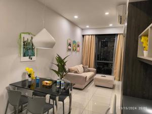 a living room with a table and a couch at Robertson Luxury Apartment in Kuala Lumpur +29 photos