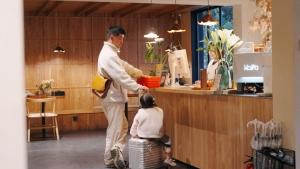 a man and a woman standing at a counter at Dali KINFOLK VILLA in Dali Ancient Town