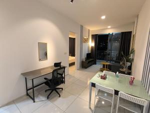 a living room with a table and chairs and a dining room at Robertson Luxury Apartment in Kuala Lumpur