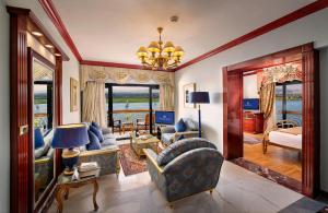 a living room filled with furniture and a chandelier at Sonesta St. George Hotel - Convention Center in Luxor +93 photos