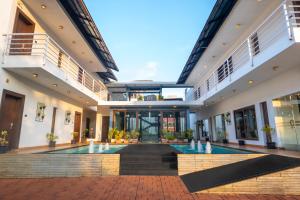 a view of the lobby of a building with a fountain at The Ivy Anjuna in Anjuna
