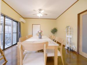 a dining room with a table and chairs at Fuji Hyakkei - Dream Bridge in Fuji