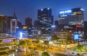 a city skyline at night with a lot of buildings at Lucky Designer Residence Near Bell Tower & City Wall in Xi'an