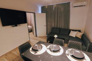 a living room with a table and a couch at Casa Calma in Esztergom