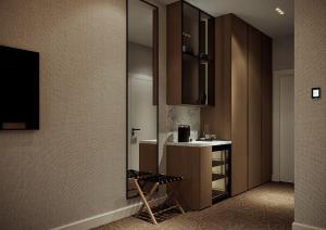 a bathroom with a sink and a mirror at Carlton Hotel Tashkent in Tashkent