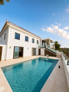 a swimming pool in the backyard of a house at Casa Era Canaria in Arona