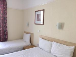Postel nebo postele na pokoji v ubytování Lockyer House B&B