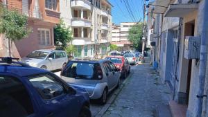 a group of cars parked on a city street at Studio Miguel in Veliko Tŭrnovo